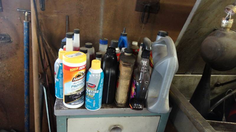 lot 1886 image: Shop cabinet with starting fluid, fuel stabalizer, etc.