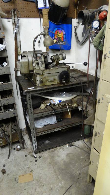 lot 1960 image: Brake lathe machine and table with contents.