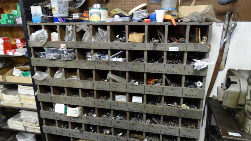lot 1961 image: Wood parts bin cabinet w HUGE lot of hardware- bolts nuts washers Lots of inventory here