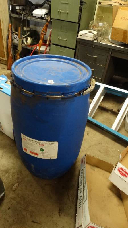 lot 1970 image: Blue plastic barrel with shop rags.