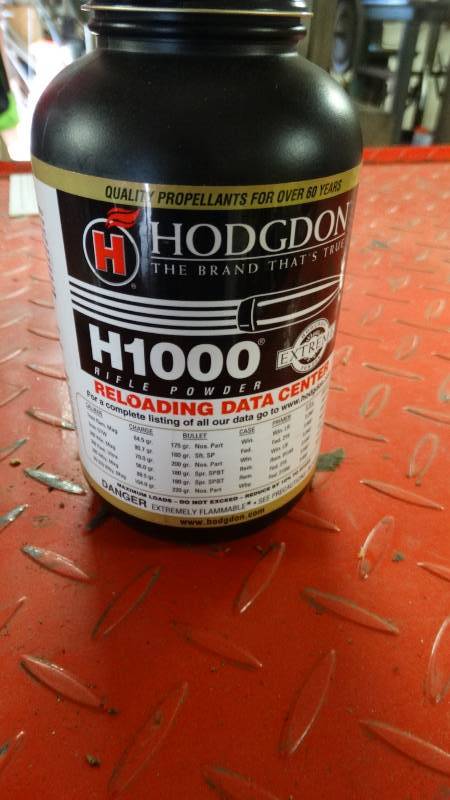 lot 1993 image: Hodgdon Rifle powder partial container.
