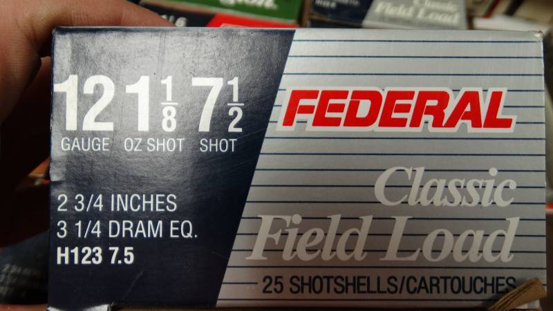 lot 5051 image: 5- federal classic field load shot shells  and 2- federal heavy game load shot shells.