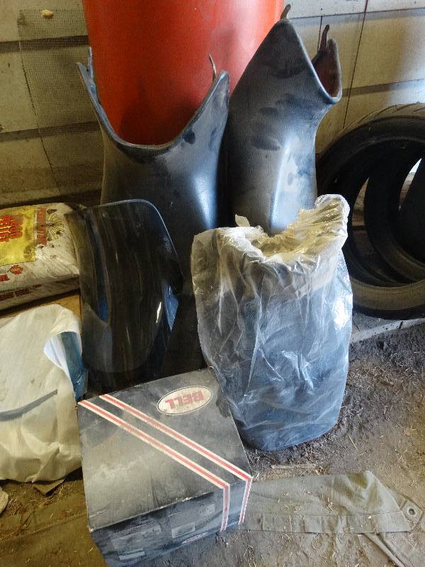 lot 5281 image: Motorcycle seats, windshields and helmet.