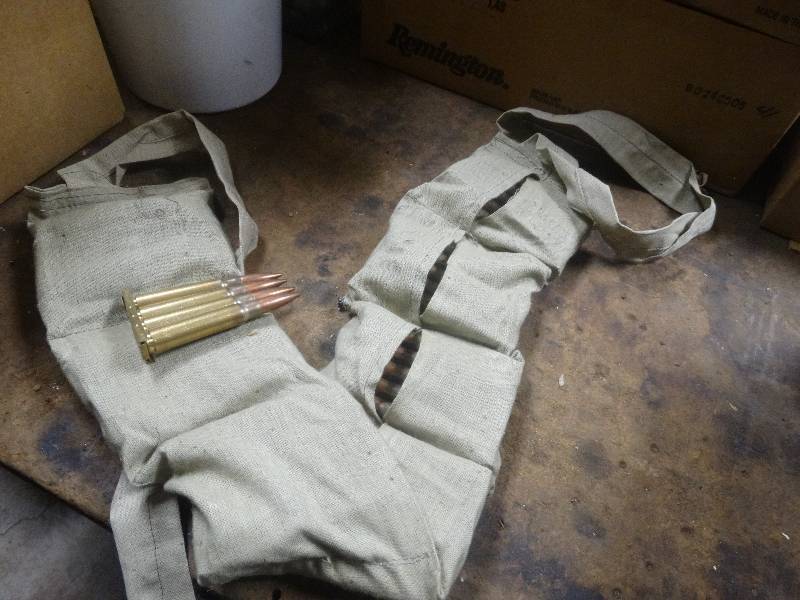 lot 5060 image: Full case-Strip loaded 8mm rounds in pouches.