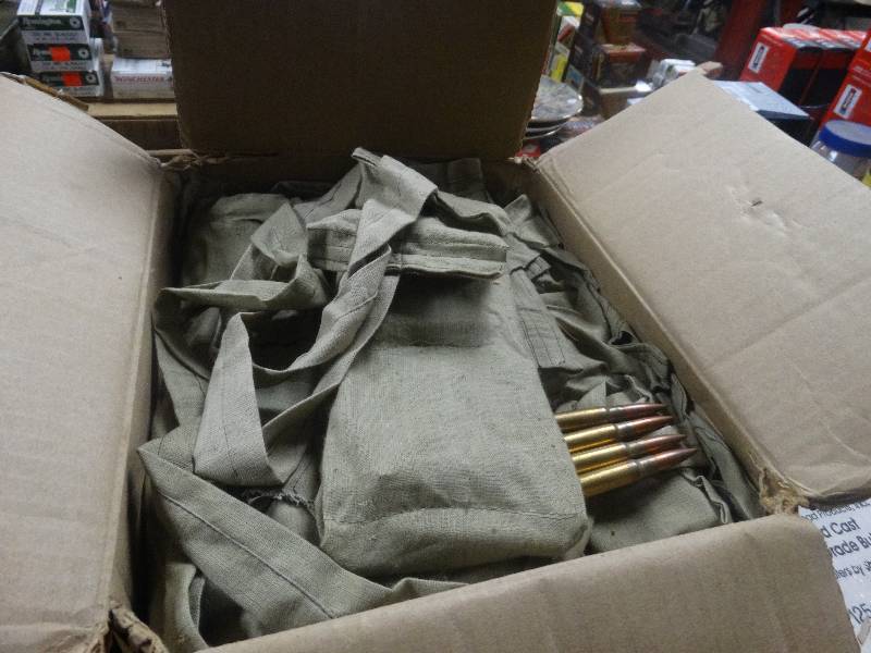 lot 5061 image: Full case-Strip loaded 8mm rounds in pouches.