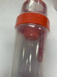 lot 338 image: cereal cup with spoon orange