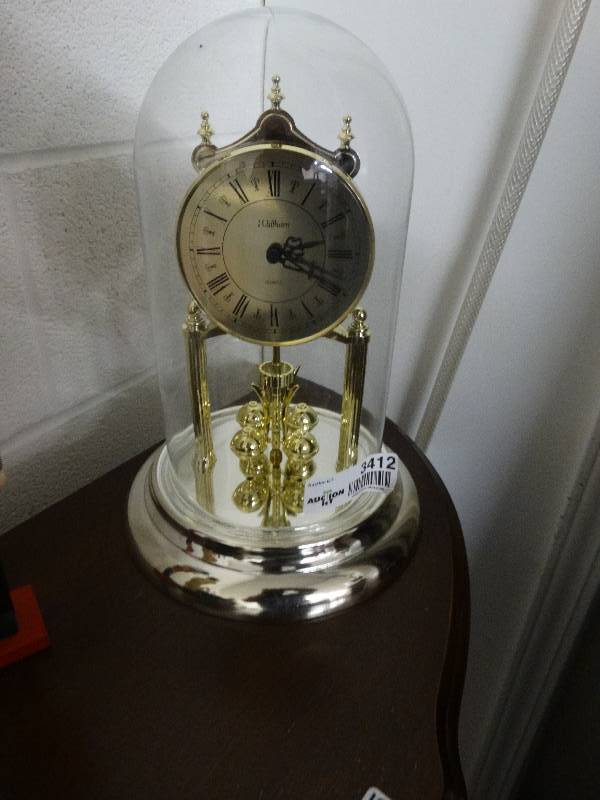 lot 3412 image: Anniversary clock w glass dome