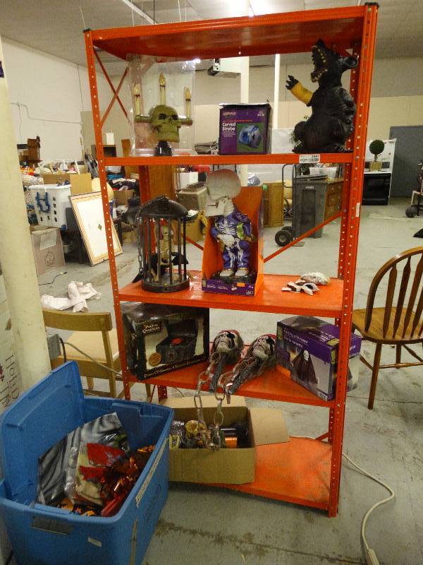 lot 3491 image: Orange metal shelf w Halloween decor