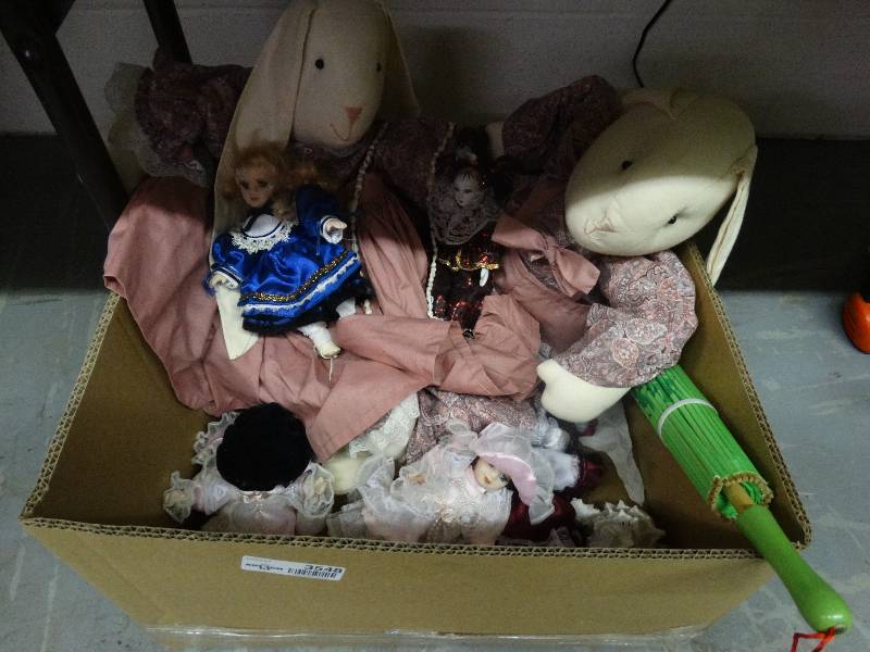 lot 3548 image: Box of Plush Rabbits, Porcelain Dolls, & a Jester. Paper Parasol.