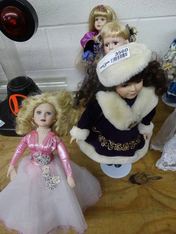lot 3560 image: 4 Porcelain Stand up Dressy Dolls.