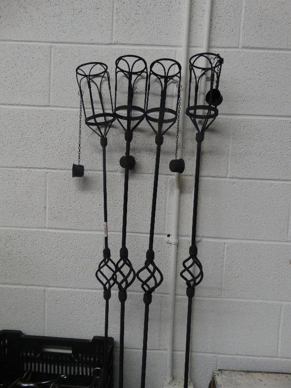 lot 3569 image: 4 Iron Tiki Torch Yard Stakes.