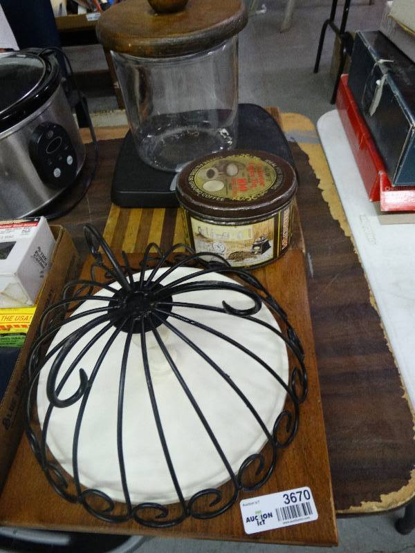 lot 3670 image: Lazy Susan, Coffee Tin, Cutting Board, Cookie Jar, Metal Basket, Scale, Wood Shelves.