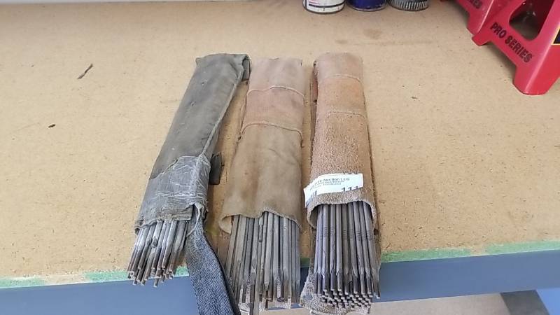 lot 111 image: Lot or 4 Leather Welding Rod Holders and Various Welding Rods