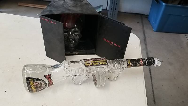 lot 98 image: Cool Liquor  Bottles-  Rolling Stones Skull and a Machine Gun