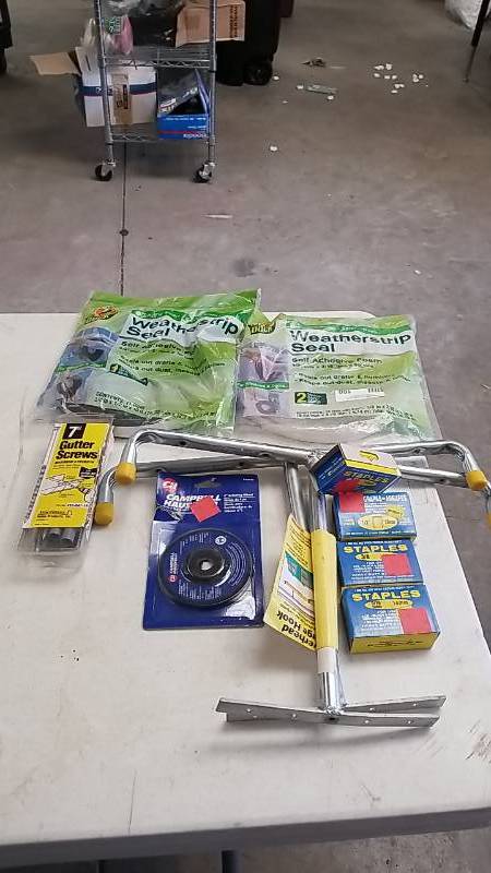 lot 100 image: Lot of  Weather Strip- Staples - Garage Hooks and Other- NEW