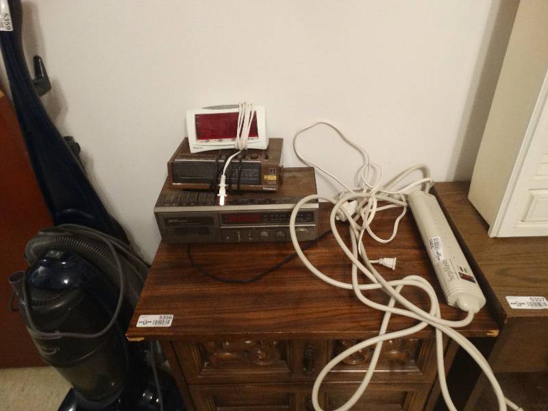 lot 5365 image: SurgeMaster extension cord, 2 alarm clocks and a radio cassette player.