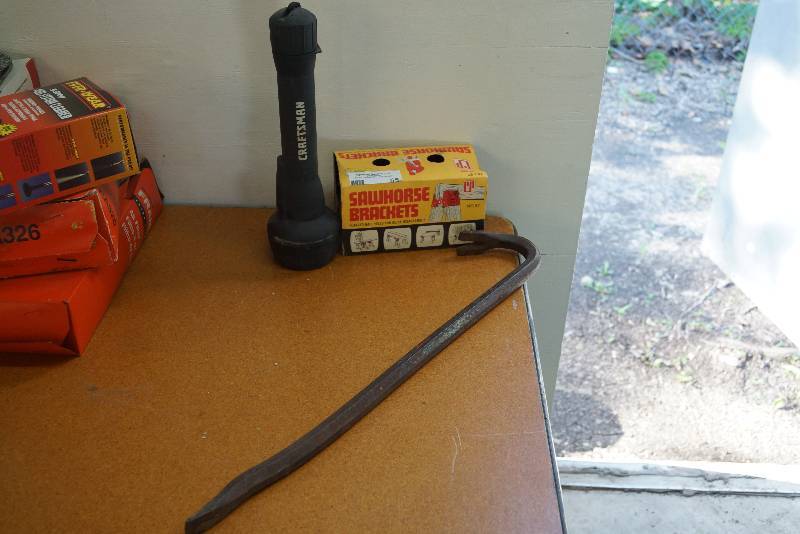 lot 55 image: Sawhorse Brackets NEW- Large Flashlight and Crowbar