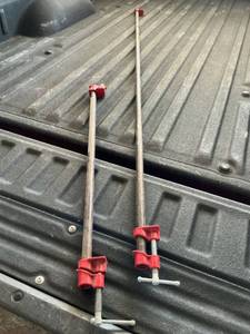 lot 48103 image: Two Pipe Clamps (one is 75 inches and one is 28 inches)