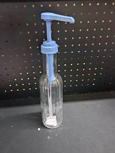 lot 12215 image: Glass Bottle with Blue Pump Dispenser