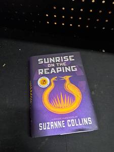 lot 12244 image: Sunrise on the Reaping - Hunger Games Novel by Suzanne Collins Walmart Exclusive