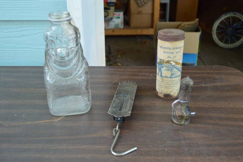 lot 4195 image: Grapette Bottle, Hanging Scale, Rubber Repair Kit and Brass Figurine- Cool
