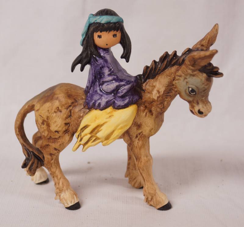 lot 2221 image: Native American Girl Riding a Donkey - Goebel Germany 1991 - See Photos for Details