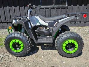 lot 7603 image: Unused&nbspYouth ATV 125cc Automatic with Custom Green Wheels