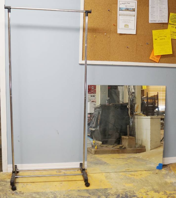 lot 2472 image: Rolling Clothes Rack and Glass Mirror 40 x 36 (a couple of chips on the bottom sides - see pics)