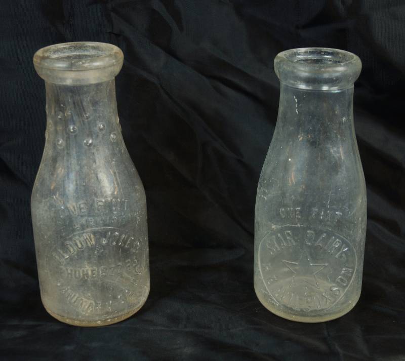 lot 2466 image: Lot of 2 - Vintage Raised Glass Pint Milk Bottles - STAR DIARY and ELDON JONES - WOW