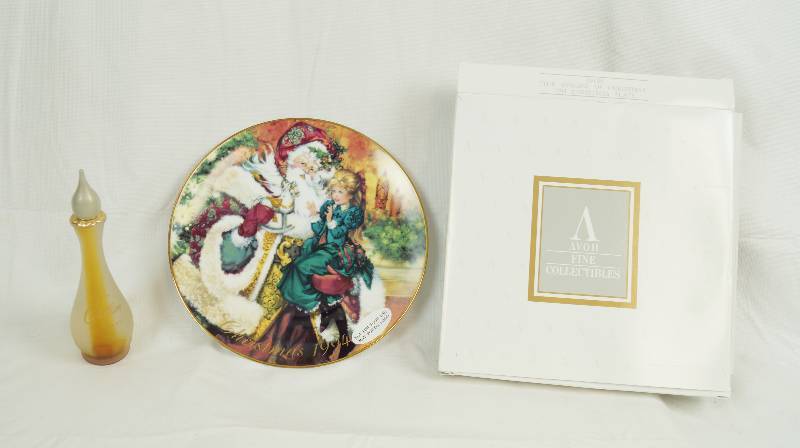 lot 6559 image: 1994 AVON Christmas Plate w original box and a collectible Avon Cotillion Perfume Bottle (empty)