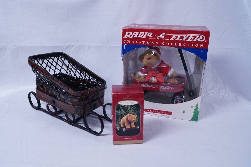 lot 2251 image: Radio Flyer Christmas Collection Bear, Wicker Sled, and Bear Christmas Ornament - Neat