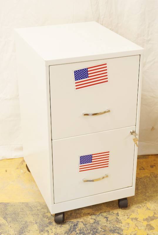 lot 3203 image: White Metal Filing Cabinet - Comes with Drawer Key - 2 American Flag Magnets - See Photos