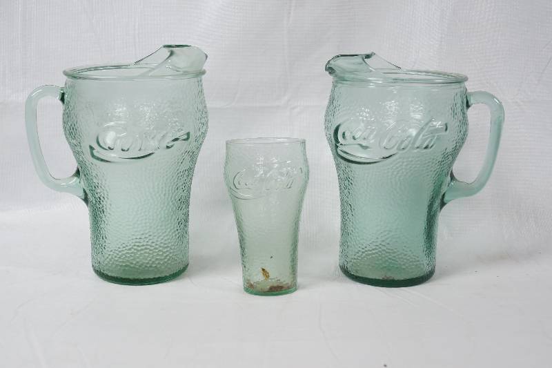 lot 3116 image: Lot of 2 Green Coca-Cola Drink Pitchers with Glass - See Photos for Details