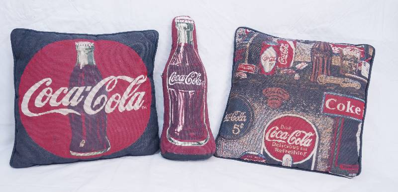 lot 3128 image: Lot of 3 Coca Cola Themed Throw Pillows - Cool