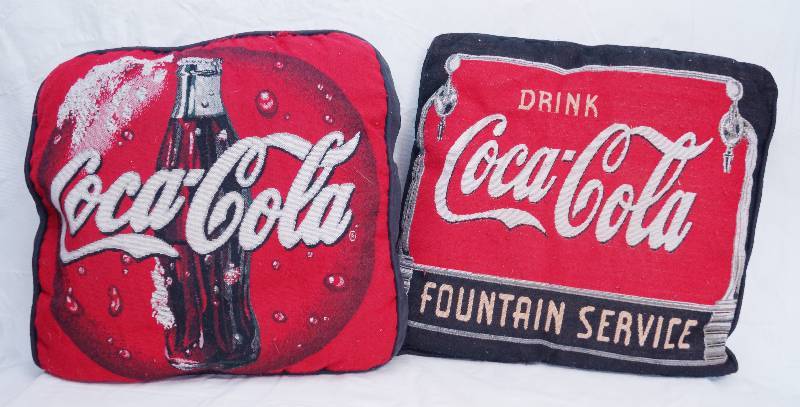 lot 3127 image: Lot of 2 Coca Cola Themed Decorative Couch Pillows - COOL