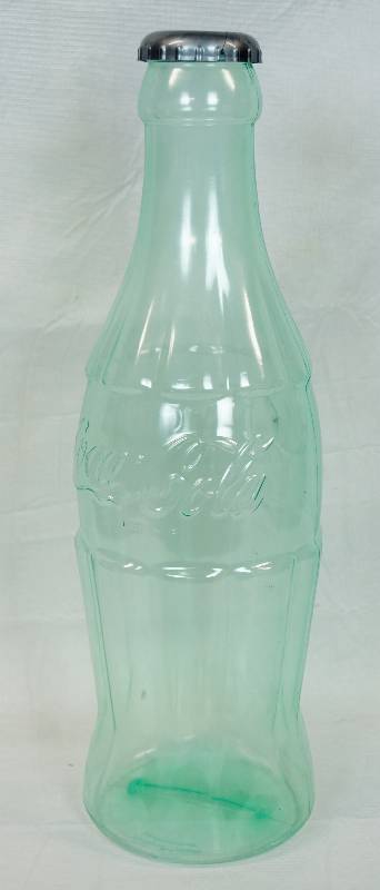lot 3349 image: Large Coca Cola Bottle Bank- Save those coins in style bank is plastic - ALMOST 2 FOOT TALL