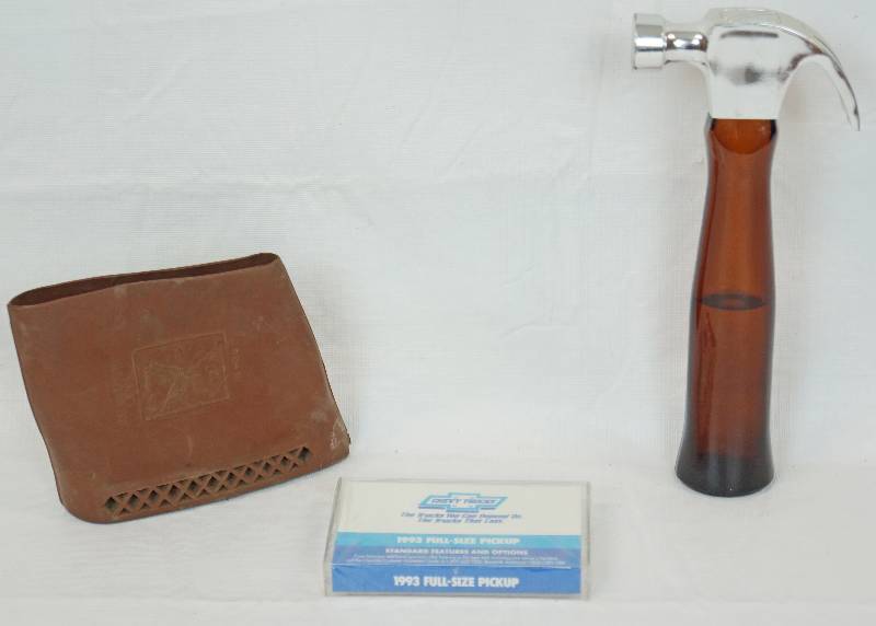 lot 3370 image: Lot of Small Items - Chevy 1993 Cassette Tape, On the Mark Aftershave and Rubber Bag - See Photos for Details