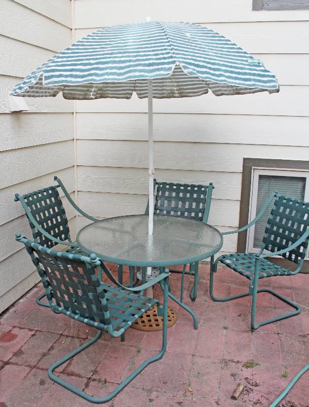 lot 9211 image: Patio Set - 4 Chairs, Table, Umbrella, and Umbrella Stand