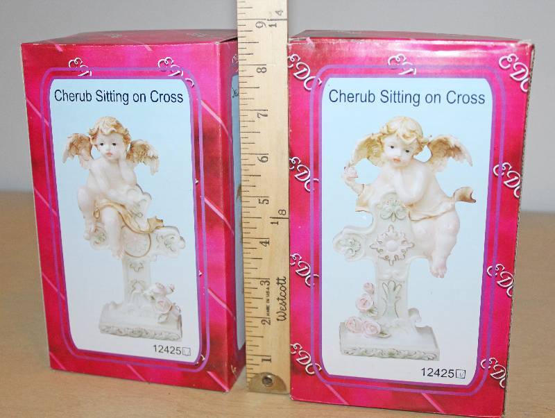 lot 9337 image: Two Cherub Sitting on Cross Figurines - New in Box