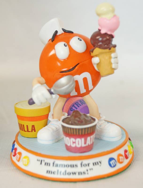 lot 1192 image: Chocolate Meltdown and Sweet Notes M&M Sweet Treats Figurines - Danbury Mint - Highly Collectible