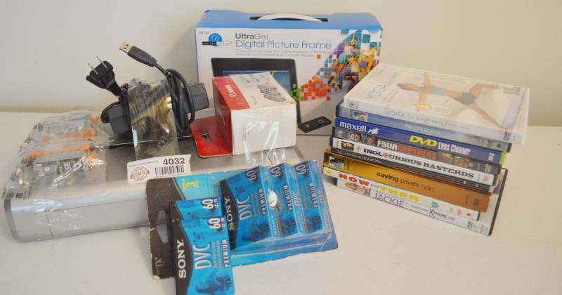 lot 4032 image: Canon Pixma ip100 Printer with extra ink, Digital Picture frame, Misc. Dvd, and Cony DVC Cassettes