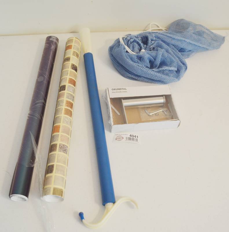 lot 4041 image: Contact paper, shoe horn, Toilet paper holder, laundry bag