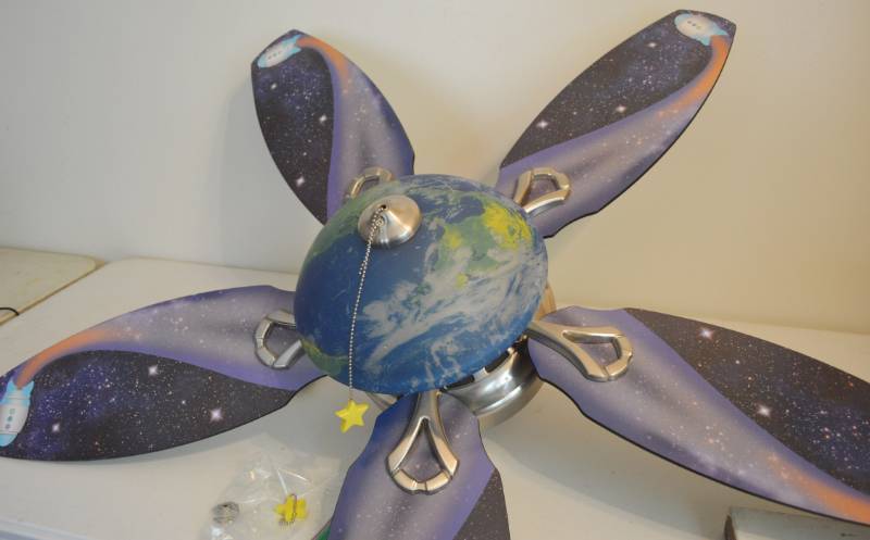 lot 4046 image: 48 Hunter Ceiling Fan with Space design blades and earth globe. Worked when removed