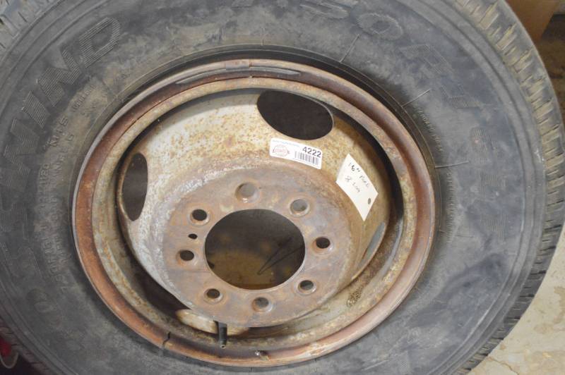 lot 4222 image: 16 Ford 8 Lug Rim. Tire is Bad