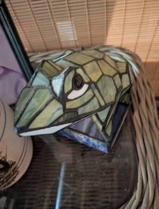 lot 607 image: Decorative Collection - Stained Glass Frog Head, Ceramic Water Dispenser, and Wicker Stand