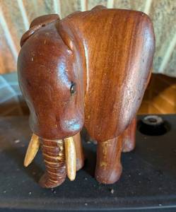 lot 626 image: Hand-Carved Wooden Elephant Figurine with Gold Tusks