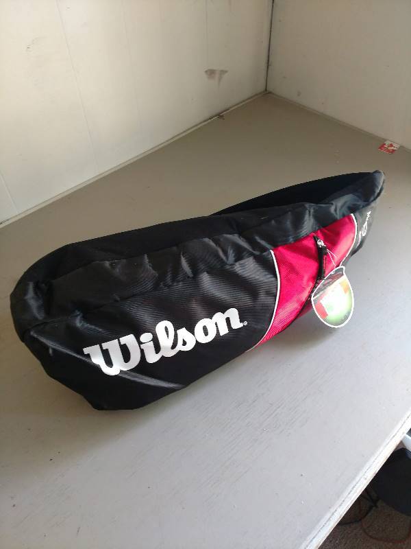 lot 10010 image: Wilson bag full of electronic equipment.