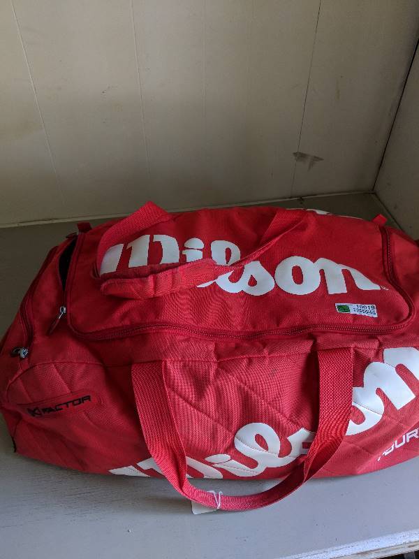 lot 10019 image: wilson bag full of dvds, movies.