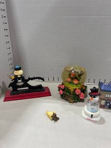 lot 1109 image: Cast iron on wood nut cracker, snowglobe music boxes