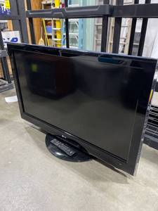lot 2055 image: LG 42 in tv with remote control